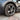Silver gunmetal multi-spoke 19-inch wheel cover on tire with center cap