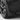 Black mud flap curved to the wheel arch, close-up on tire and rim