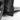 Close-up of installed black mud flap with mounting tab and screw hole