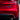 3D alloy performance badge on red tail section, small rectangular blue-and-silver starburst