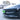 Glossy black front bumper lip spoiler with angled grille-style air openings