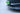 Installed carbon fiber front bumper lip spoiler with vented, stepped design