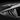 Rear side window louvers with carbon-fiber texture and curved vent slats in dark black