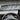 Air vent deflector strip across dashboard vents, airflow lines visible