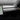 Car dashboard overlay cover with dark alcantara-like panel and vent trim