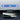 Blue Alcantara-style reading light wrap sticker with two end knobs and center hazard icon