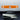 Orange Alcantara-style reading light wrap sticker with two end knobs and center hazard icon