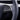 Steering wheel panel wrap closeup, dark textured control-area sticker with icon cutouts