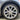 Wheel cover installed on car wheel, showing light satin silver multi-spoke spokes