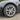 Wheel cover installed on car wheel, with satin silver multi-spoke pattern and center hub