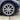 Satin silver aero wheel cover with star spokes on front wheel and tire