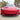 Carbon fiber V-style front lip splitter on red Tesla Model 3 front bumper