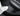 Carbon fiber door sill protector strip near seat, black with textured pattern