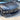 Carbon fiber V-style front lip splitter on gray Tesla Model 3 front, close-up