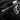 Carbon fiber interior trim along dashboard and steering area, dark weave with silver lines