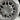 Close-up of gray octagonal wheel hub cover with round center button
