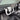 White yoke steering wheel with carbon-fiber center area and textured side grips