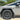 Black cyberbeast emblem badge mounted on a light gray vehicle