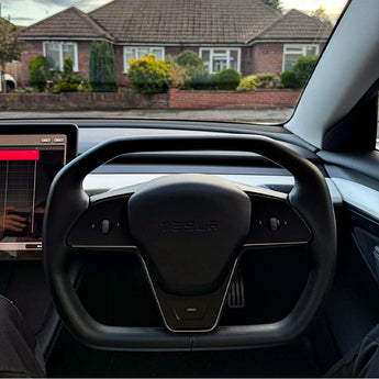 Cybertruck-style heated steering wheel cover in black nappa leather with centered emblem