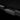 Rear bumper protector insert with cutouts and matte dark finish for Tesla Cybertruck