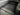Black mesh cargo net covering truck bed floor with raised side frames