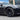 Side view of dark satin wheel cover with multi-spoke aero design