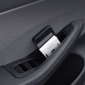 Car door storage organizer holding a phone and small accessories in black tray