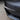 Black carbon-fiber style fog light trim surround for Tesla Model 3/Y bumper