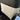 White seat back kick protector mat with stitched border and pocket