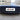 Front bumper grille insert installed on vehicle, dark mesh and slat grille surround