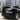 Glossy black rear spoiler wing on the back of a Tesla Model Y