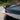 Glossy black rear spoiler wing corner view on the vehicle
