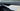 Glossy carbon-fiber door trim accent strip along interior panel