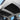 Car panoramic roof sunshade, black fabric panels with gray edges installed