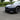 Front lip spoiler for Model 3 in glossy black ABS, attached to front bumper