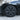 Dark wheel cover installed on a car wheel, multi-spoke design visible