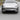 Front bumper add-on kit with black lower lip spoiler and side splitter fins.