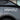 White RZATAXI vinyl decal on gray car rear quarter panel