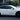 Black RZATAXI vinyl decal on white car side door