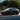 White RZATAXI vinyl decal on dark car rear door panel