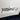 Black RZATAXI vinyl decal on white car door panel