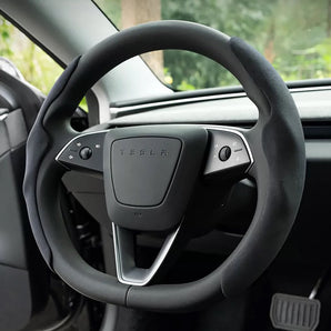 Black suede steering wheel cover with Tesla badge and textured grip surface