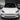 Carbon fiber front lip splitter on white Tesla Model 3 front bumper