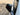 Dark carbon fiber mirror cap on side mirror, angled exterior view