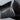 Close-up of two carbon fiber mirror cap surfaces with visible weave pattern and seams.