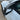 Dark carbon fiber mirror cap cover with woven texture on car
