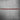 Red accent trunk trim strip with black carbon fiber backing