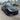V-style carbon fiber front lip splitter on dark sedan front bumper