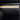 Real carbon fiber glove box cover insert with dark carbon-fiber texture