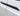 Black carbon fiber door handle cover, textured curved overlay on car door